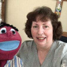 Kathy Dawson and her handmade puppet Zeb.